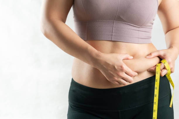 An uneven lower belly fat can be caused by